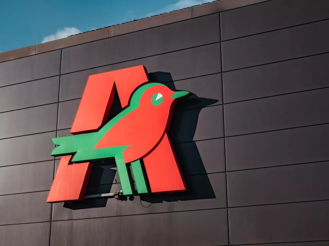 GDYNIA, POLAND - SEPTEMBER 29, 2022Auchan logo on a shopping centre wall