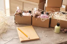 Preparing parcels for shipment to customer on table